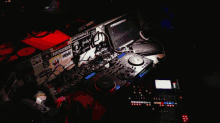 a dj 's setup with stickers on it including one that says bitchfucker