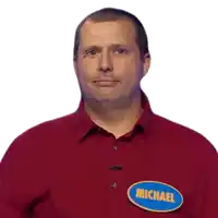 a man wearing a red shirt that says yup michael