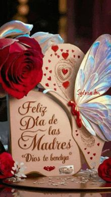 a card that says feliz dia de las madres is surrounded by red roses