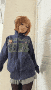 a woman wearing a blue sweatshirt with the number 88 on the front