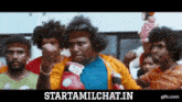a group of men wearing boxing gloves are standing in front of a sign that says starttamilchat.in .