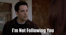 a man says " i 'm not following you " while talking to a woman