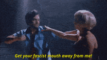 a woman with blonde hair and red lips is laying on the ground and says you hit a woman