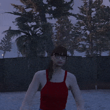 a woman in a red tank top and glasses stands in front of a fence