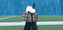 a person with antlers on their head is standing on a soccer field
