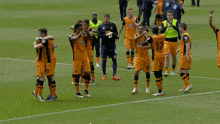 a group of soccer players on a field with one wearing a number 17 jersey