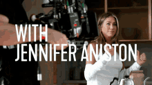 a woman in a kitchen with the words with jennifer aniston
