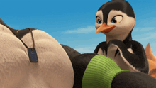 a cartoon penguin with a tag that says ' i 'm a penguin ' on it