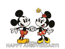 mickey mouse and minnie mouse are holding hands and kissing in a happy anniversary greeting card .