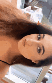 a close up of a woman taking a selfie