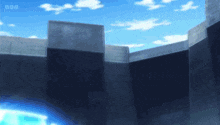 a wall with a blue sky in the background and a bbc logo in the corner