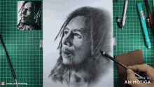 a drawing of a man with dreadlocks is on a green cutting board