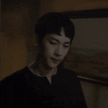 a blurry picture of a woman 's face in a dark room