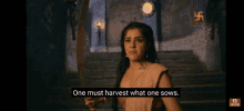 a woman is holding a sword and says " one must harvest what one sows "