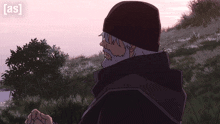 a man with a beard wearing a black hat is standing in a field with a sunset in the background