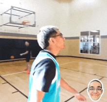 a man in a blue jersey is playing basketball