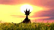 a silhouette of a dragon sitting in a field with the sun in the background