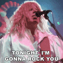 a man singing into a microphone with the words " tonight i 'm gonna rock you " below him