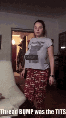 a woman wearing a t-shirt that says " thread bump was the tits "