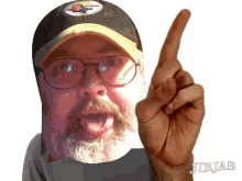 a man wearing a pittsburgh steelers hat is pointing upwards