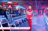a wrestler named jimmy uso is walking down a ramp