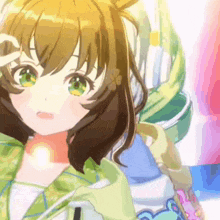 a girl with brown hair and green eyes is wearing a green shirt