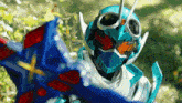 a person wearing a blue helmet and goggles is holding a blue sword
