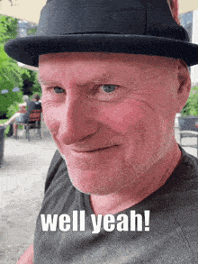 a man wearing a hat with the words well yeah written on his face