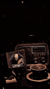 a man with a beard sits in front of a radio that says the best 10
