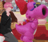 a girl with pink hair is kneeling next to a pink stuffed animal