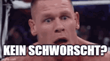 a close up of a man 's face with the words kein schworscht written above him