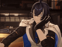 a man with long black hair wearing glasses and gloves