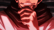 a close up of a person 's face with their hands folded