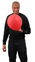 a man in a black shirt is holding a large red balloon