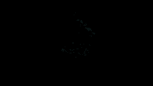 a close up of a person 's face in the dark with a smile on their face