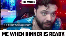a man with a beard is sitting in front of a computer screen with the words me when me when dinner is ready above him