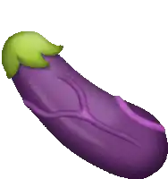 a purple eggplant with a green leaf on top of it