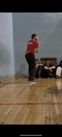 a man wearing a red shirt that says ' georgia ' on it