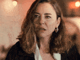 a woman with a tear running down her face