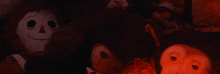 a group of stuffed animals including a monkey and a rabbit