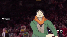 a man in a green jacket is standing in front of a crowd with a tnt logo in the background