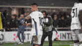 a soccer player with the number 10 on the back of his shirt