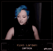 a woman with blue hair is talking on a video call .