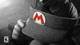 a person wearing a hat with a m on it