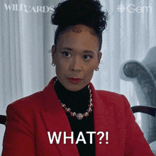 a woman wearing a red jacket and a black turtleneck says what ?