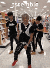 a group of people are dancing in a store and the word assemble is on the bottom