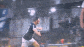 a soccer player wearing a number 7 jersey is running in a stadium