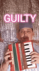 a man is playing an accordion with the word guilty written above him