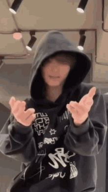 a person wearing a hoodie that says ' nct ' on it