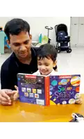a man is reading a book to a young boy titled solar system
